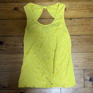 A. Byer women’s (juniors) yellow tank top with bow on the back